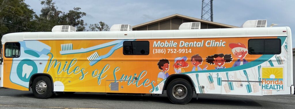 Miles of Smiles dental bus in parking lot
